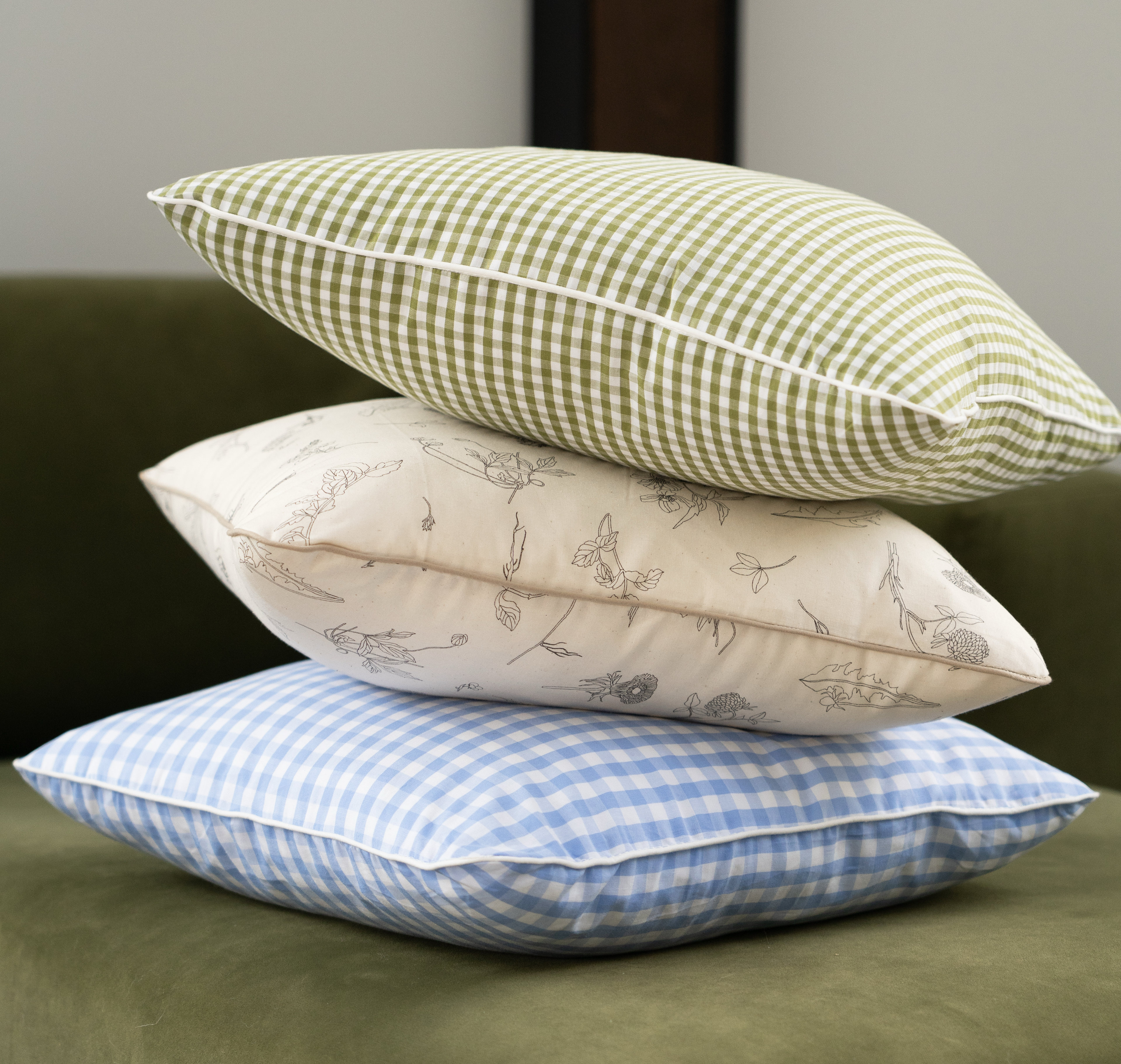 three patterned cushions stacked 