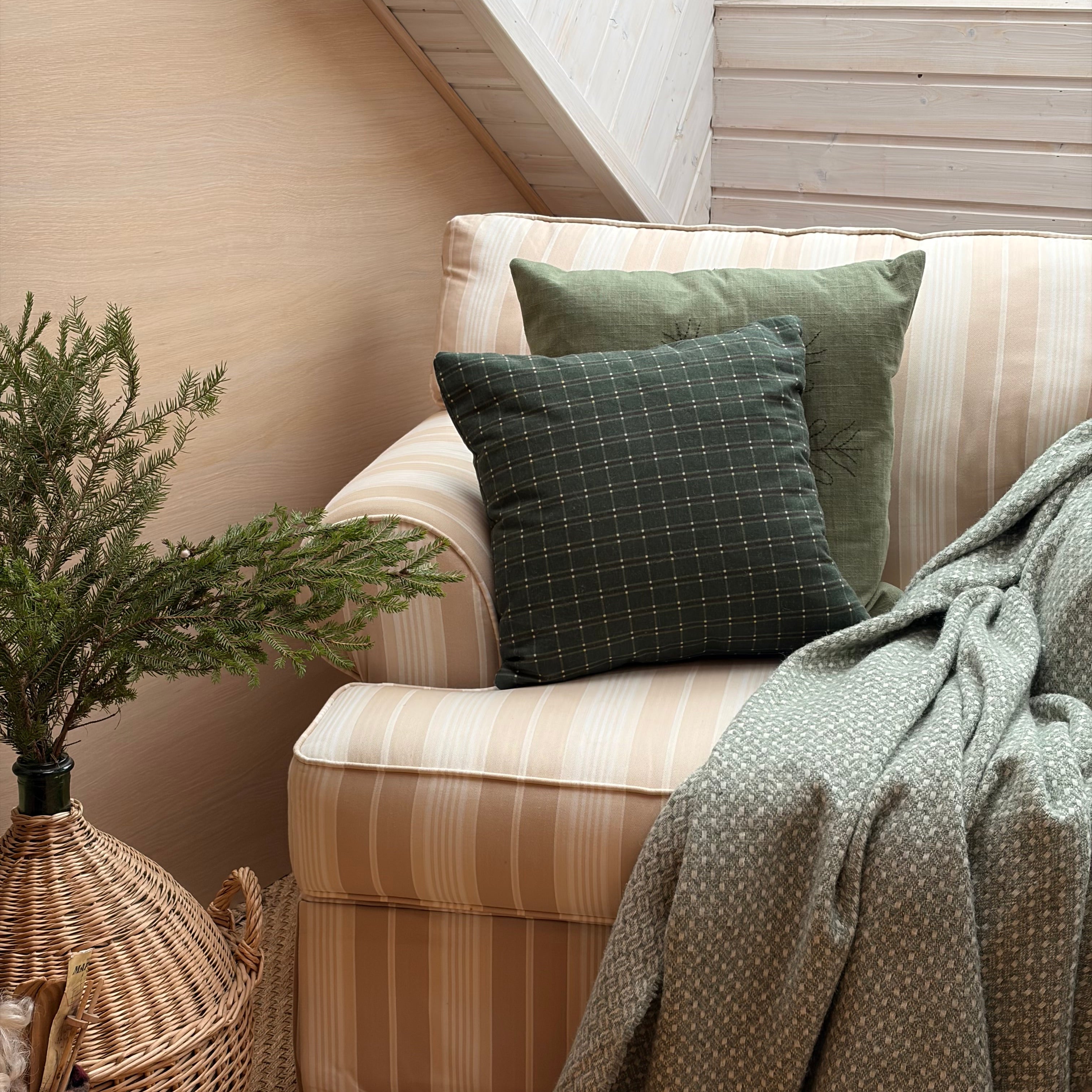 Abruka cushion on an armchair