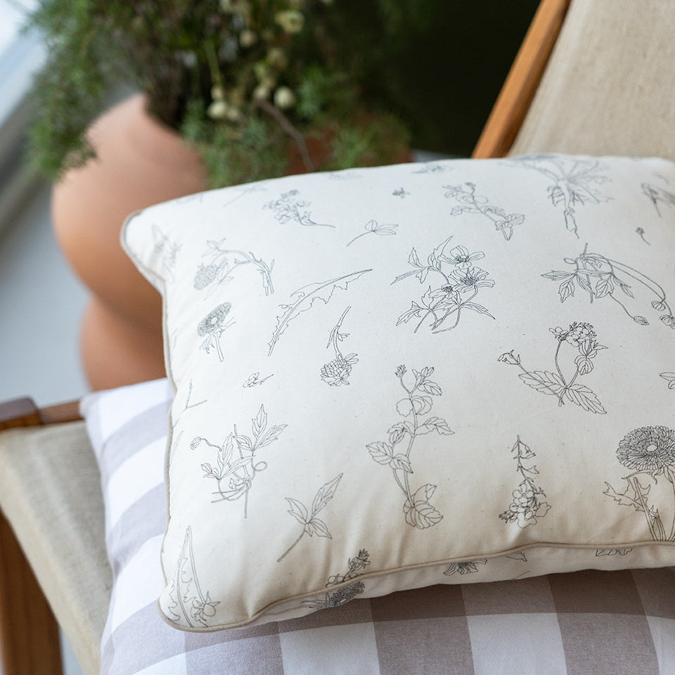 floral cushion on a canvas chair