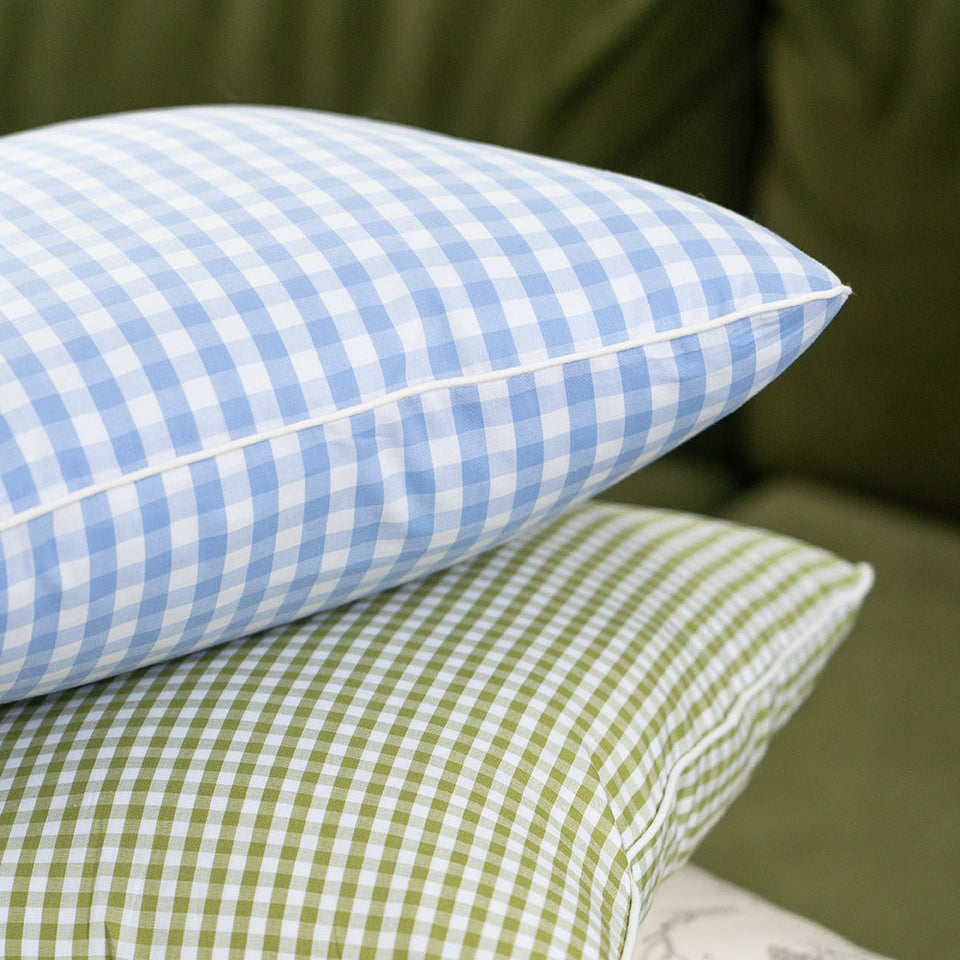 blue and green gingham cushions stacked