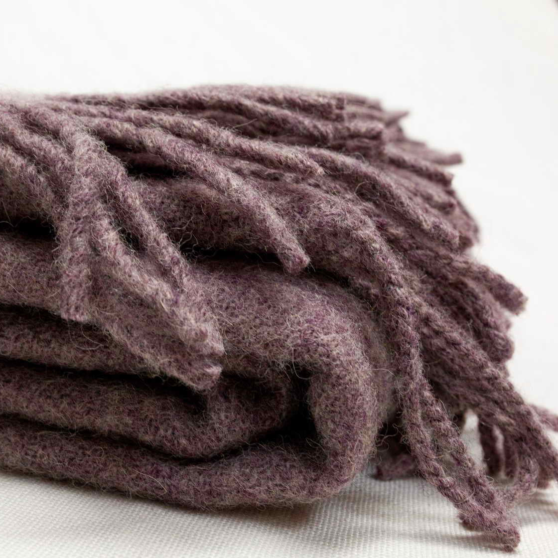 Lilac merino wool throw close up on a light background