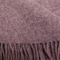 Close-up of a textured lilac merino wool with fringed edge