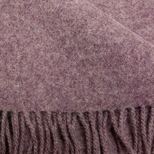 Close-up of a textured lilac merino wool with fringed edge