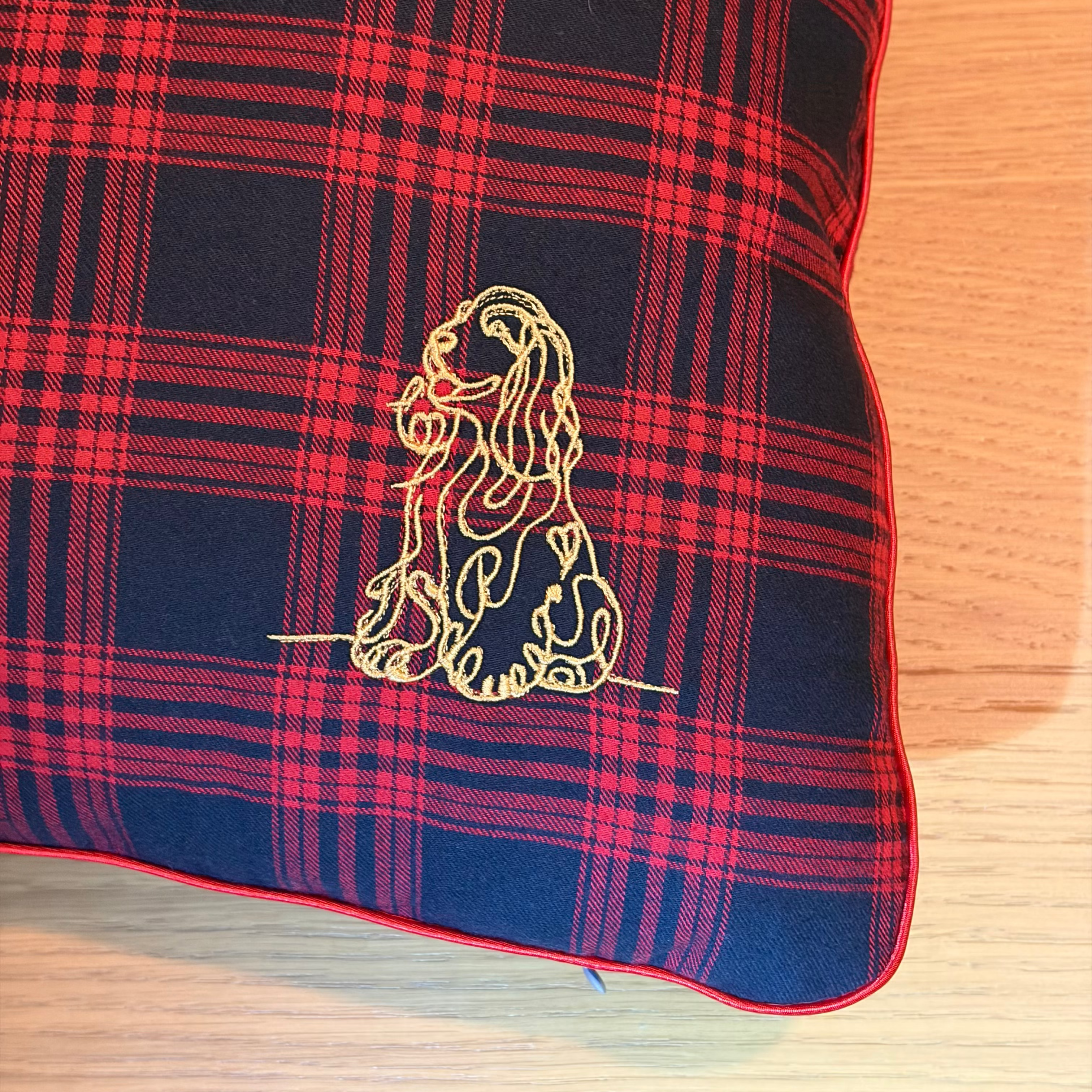 tartan cushion embroidered with a cocker spaniel